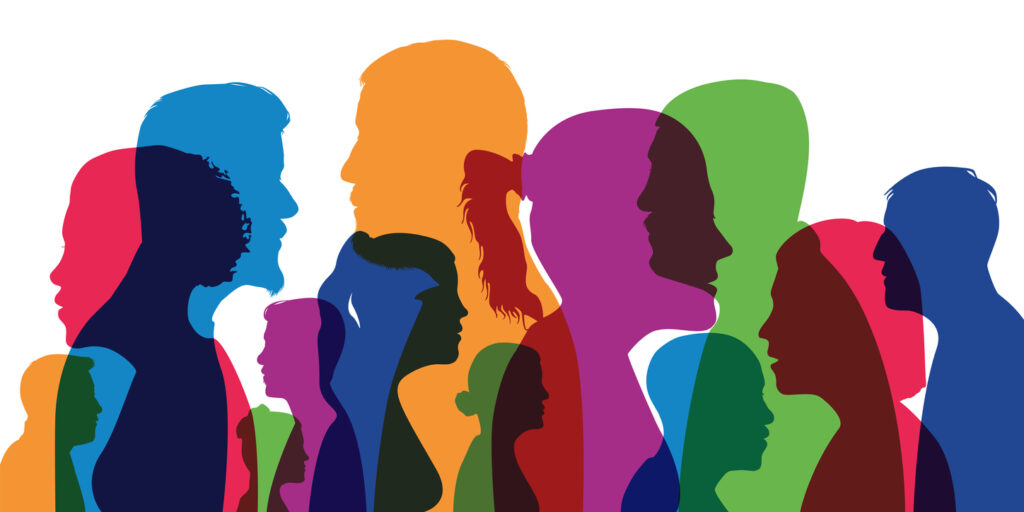 Concept of a cosmopolitan population with different silhouettes of men's and women's heads in colors and profile views.