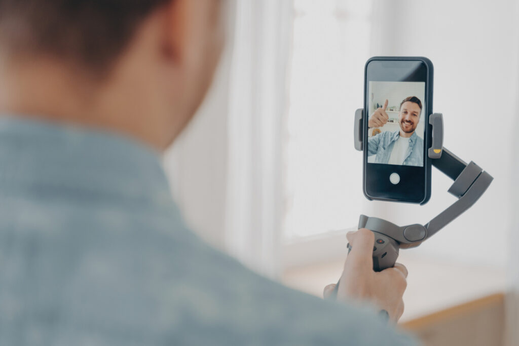 man making selfie on smartphone