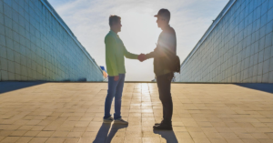 skilled worker shaking hands with an employer in the BMS industry