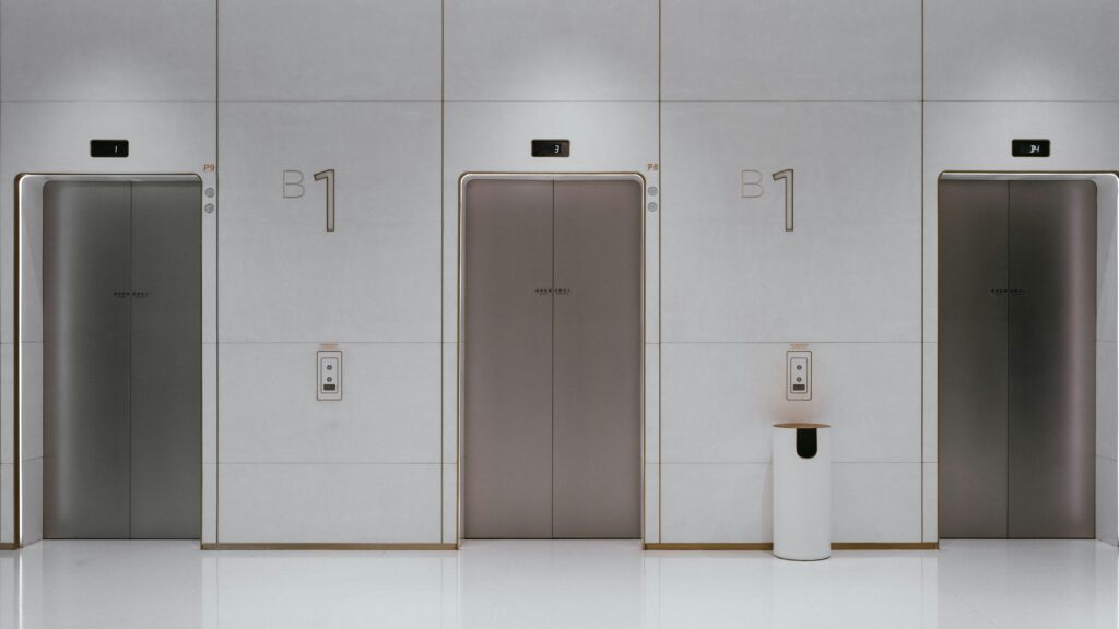 three elevators with their doors closed