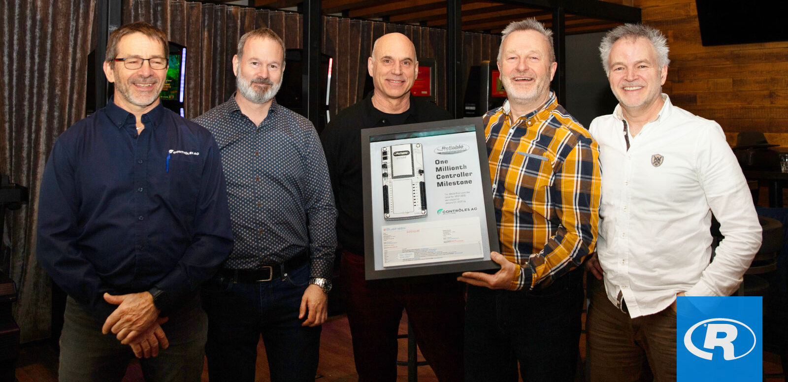 Contrôles AC team celebrates Reliable Controls’ millionth controller milestone.